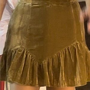 Gold velvet mini skirt.